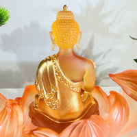 Lotus Serenity · Amber-Toned Liuli Buddha Sculpture with Lotus Base