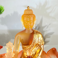 Lotus Serenity · Amber-Toned Liuli Buddha Sculpture with Lotus Base