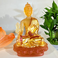 Lotus Serenity · Amber-Toned Liuli Buddha Sculpture with Lotus Base