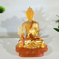 Lotus Serenity · Amber-Toned Liuli Buddha Sculpture with Lotus Base
